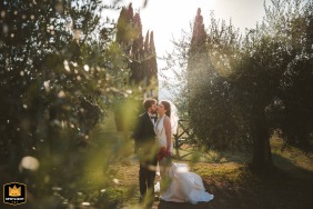 Bride and groom sharing a kiss for a couple’s portrait at Castello di Modanella in Tuscany.